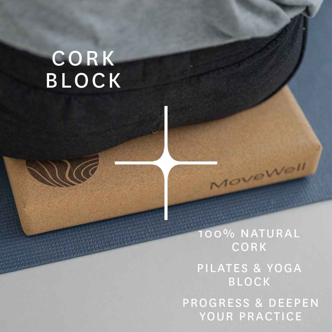 A cork yoga block branded MoveWell, shown under a gray shirt with a black belt, on a blue Pilates mat. White text overlays read 'CORK BLOCK' and '100% NATURAL CORK PILATES & YOGA BLOCK'.